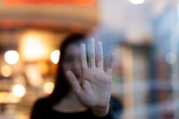 woman-showing-gesture-stop-violence-against-women-concept 360 x 240